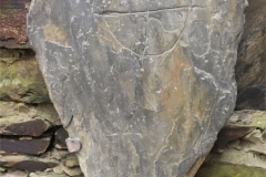 This roughly triangular slab was found while ploughing on Baroose Farm in 1959